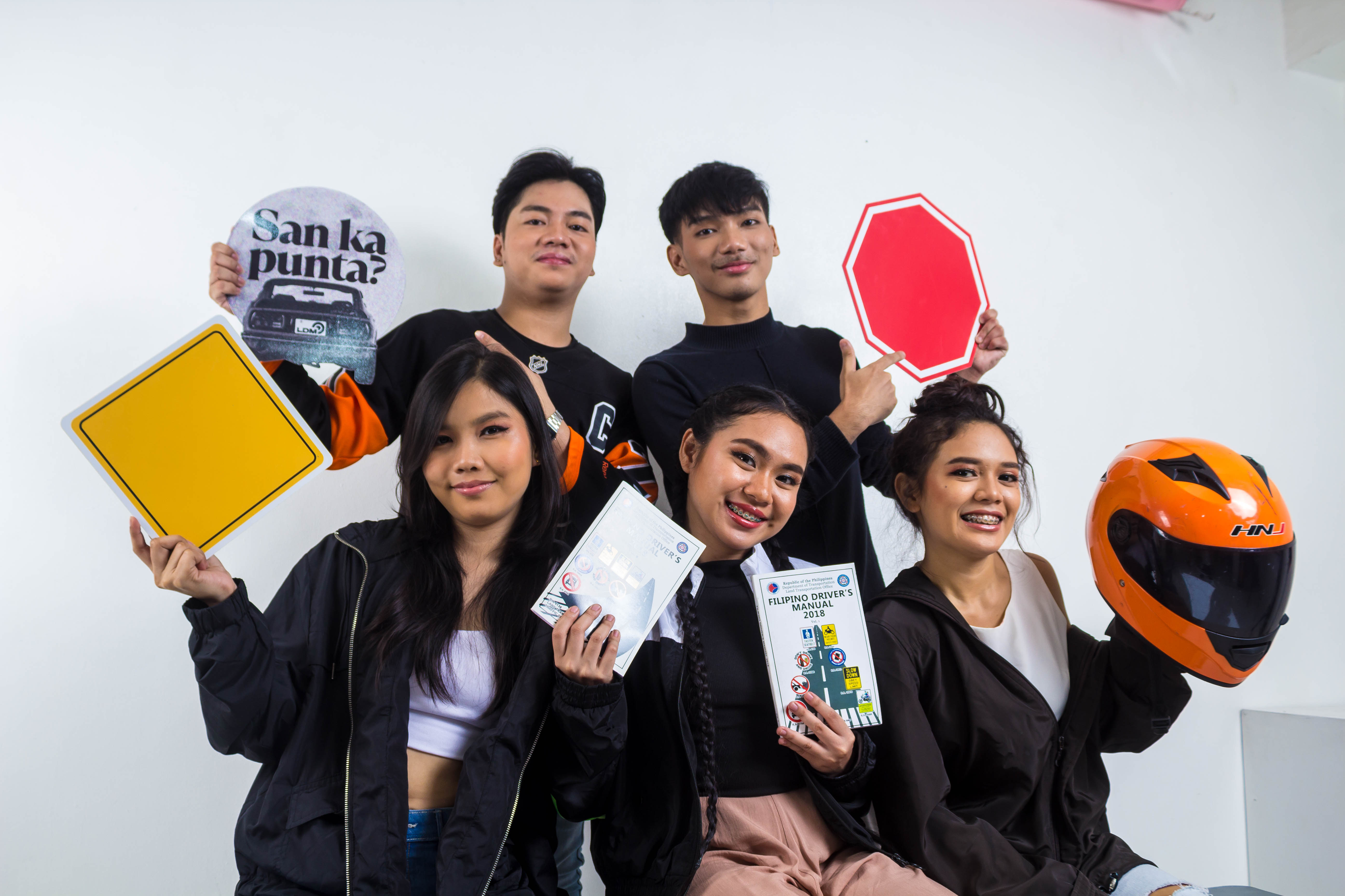 Students practicing road signs for driving test preparation