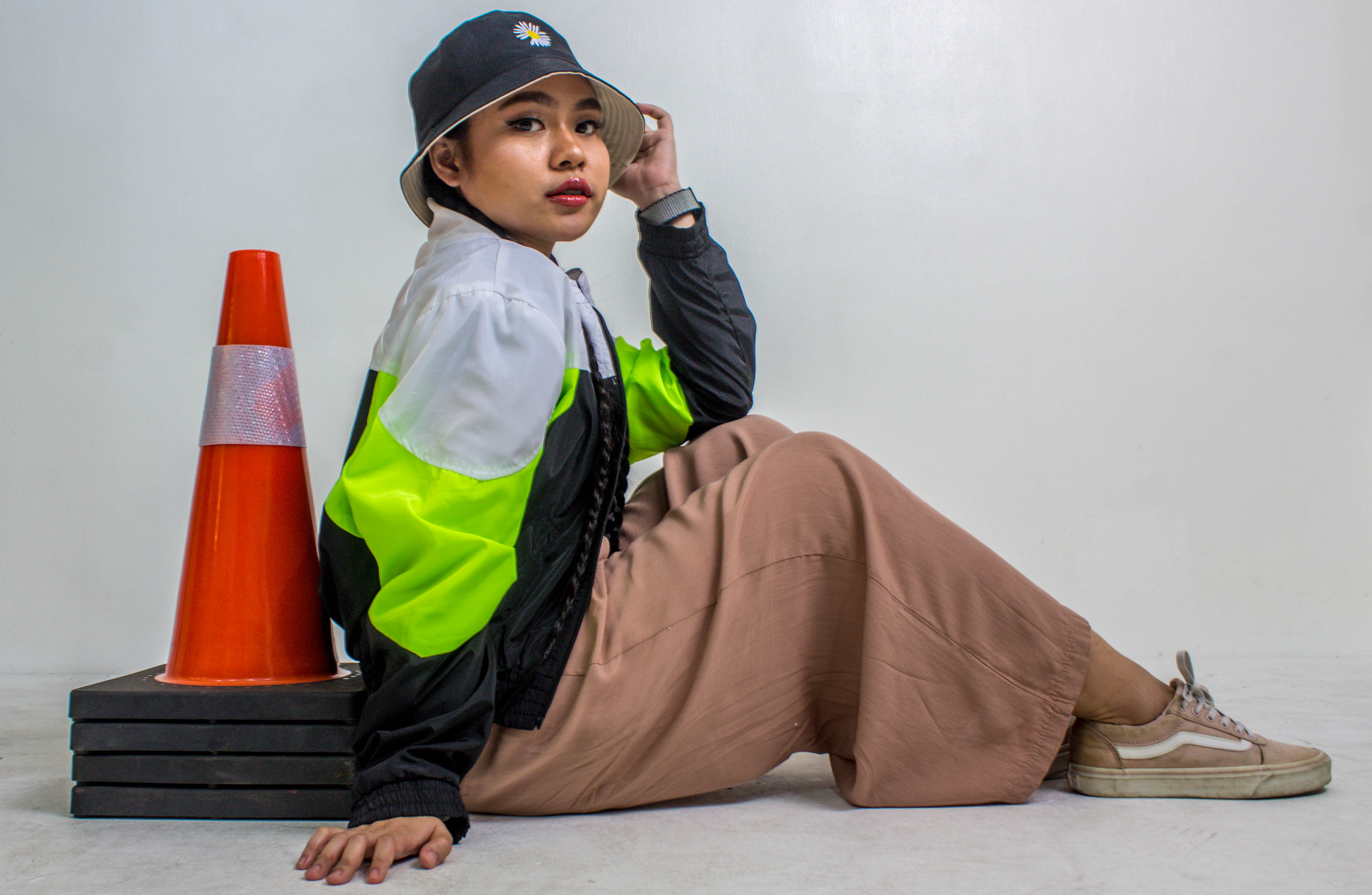 Refresher driving student with traffic cone